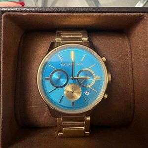 Michael Kors Men's Watch with Blue Dial and Gold Band